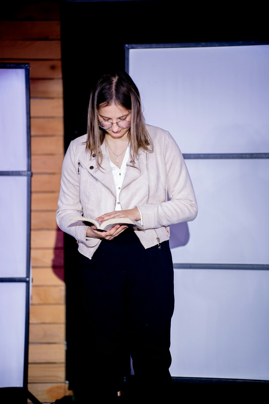 woman presenting on stage