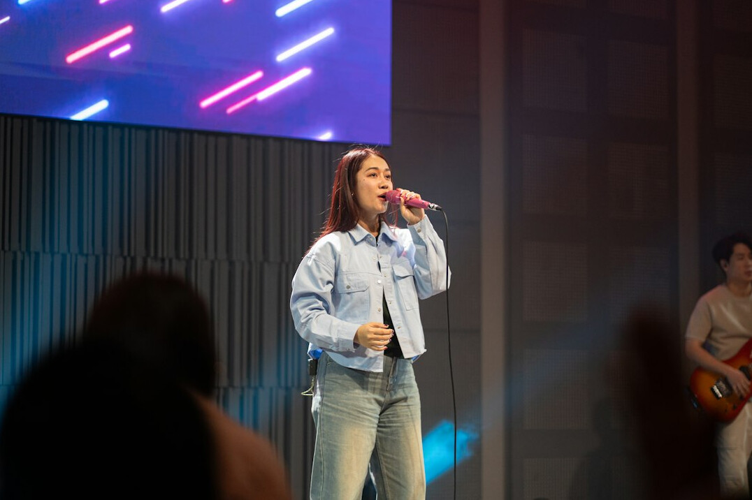 person speaking confidently on stage